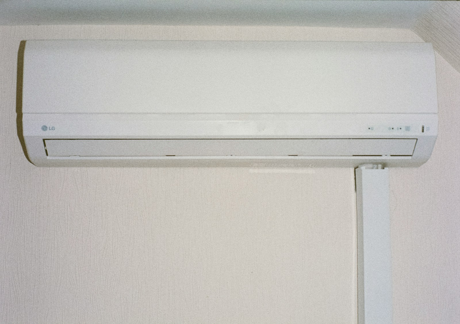 A white air conditioner mounted on a wall.